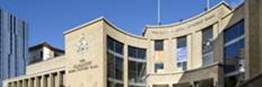 A picture containing text, building, outdoor, government building
Description automatically generated